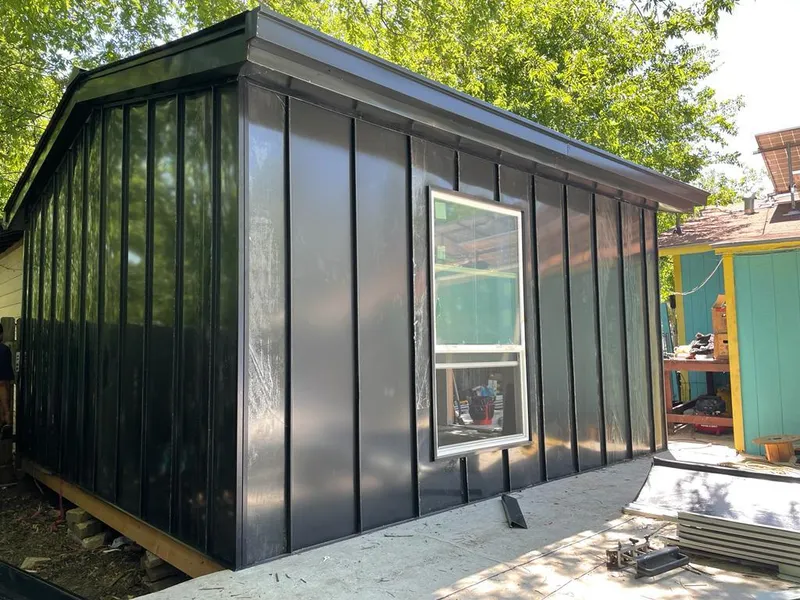 Black standing seam metal wall panels for Metal Roof Installation in Pembroke